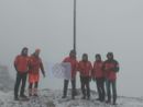 La bandiera del 70° anniversario della nascita del Soccorso Alpino issata sulle croci del Cistella, Zeda e Massone
