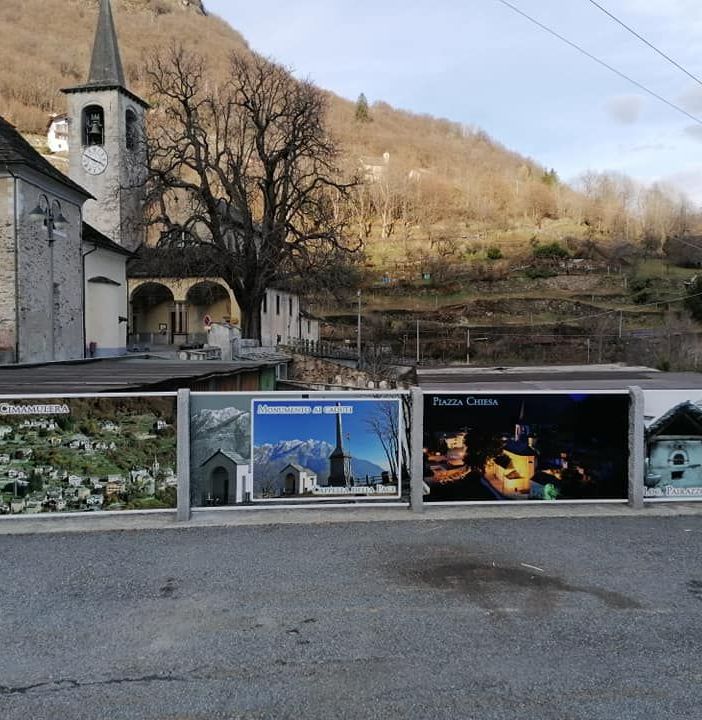 Gigantografie abbelliscono la piazza di Cimamulera