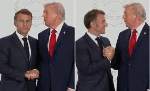 Trump e Macron, il balletto per la solita stretta di mano extralarge Trump e Macron, il balletto per la solita stretta di mano extralarge